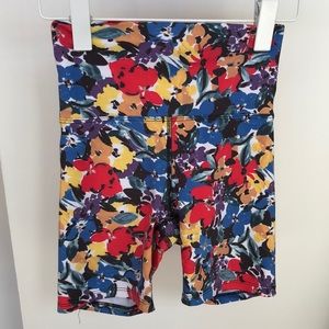 BeachRiot biker shirt with painted floral pattern in blue/red/yellow